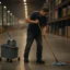 warehouse worker mopping floor cleaning